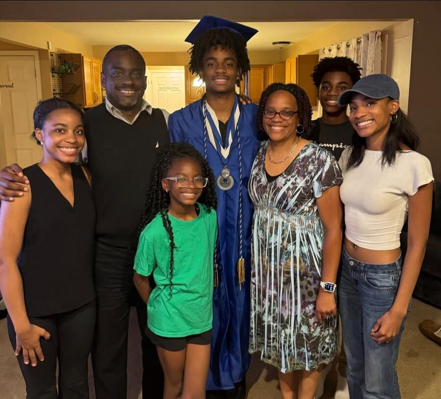 Gregory Myers with his family at a graduation celebration